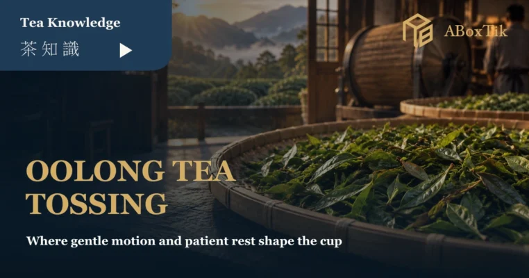 Fresh oolong leaves resting in bamboo trays after controlled tea tossing in a Taiwanese tea workshop