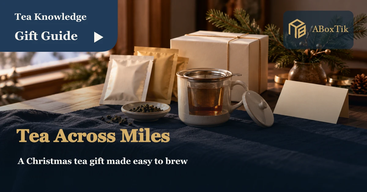 Christmas tea setting with a mug, infuser, plain gift box and blank card by a window