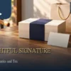 Company logo tea gifts scene with a neutral box, navy sleeve, blank card and tea cups