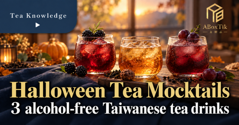 Three Halloween tea mocktails with blackberry, plum and grape, in clear iced glasses on a warm tea table