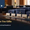 Plain navy tea gift boxes and blank cards in a conference setting