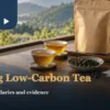 Tea cups, loose leaves and blank information cards on a table for reviewing low-carbon tea claims