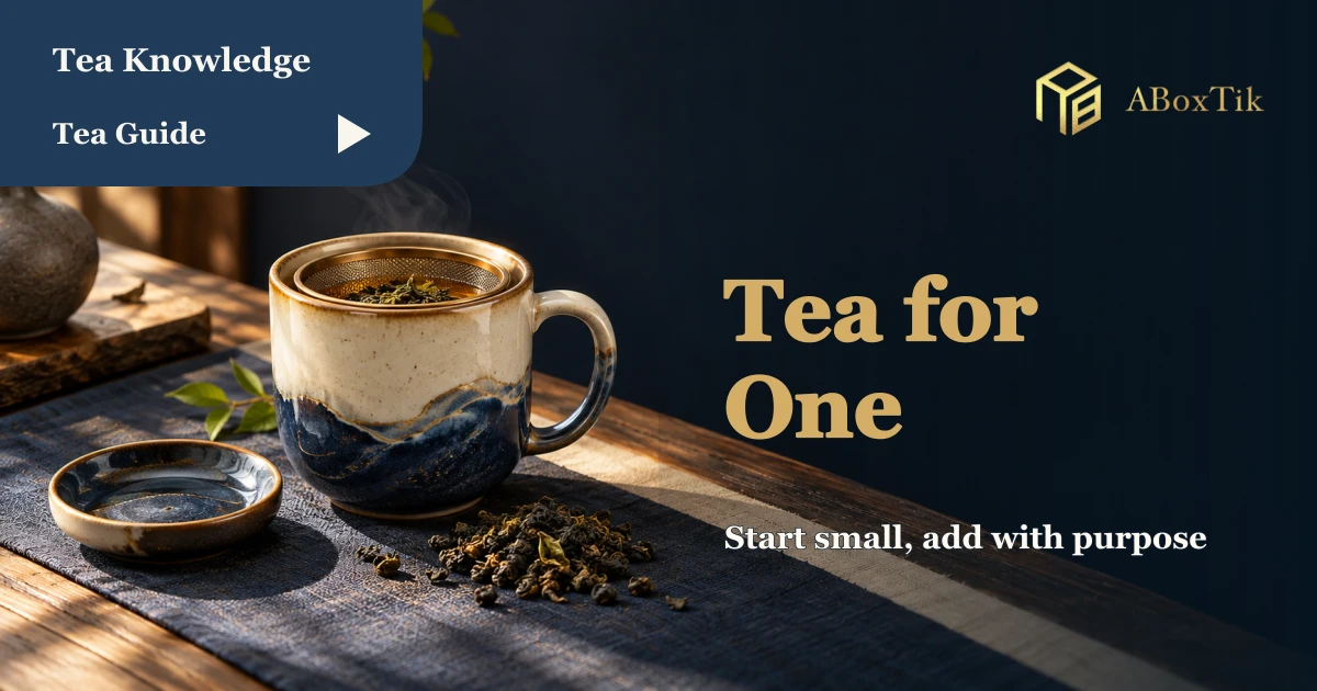 A tea-for-one setup with a handled mug, removable basket and rest dish