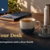 Office tea brewing with a mug, removable strainer and a separate flask on a wooden desk