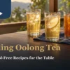 Three glasses of plain, lemon and orange sparkling oolong tea on a warm window-side dining table