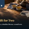 Tea gifts for partners with two cups, a blank card and a travel photograph