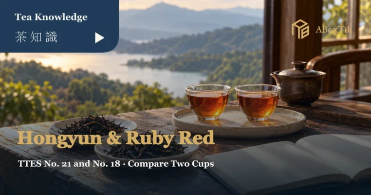 Hongyun vs Ruby Red comparison setting with two amber-red teas, a ceramic teapot, dry leaves and a blank notebook